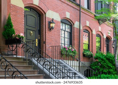 Charming red brick townhouse entrance with blooming window boxes  in Boston, Massachusetts, USA - Powered by Shutterstock