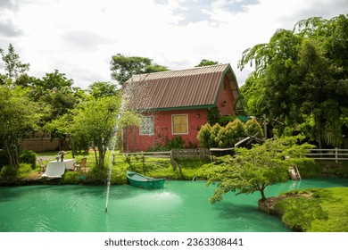 A charming café and restaurant with a natural style, featuring a building covered in ivy. A haven for coffee lovers. - Powered by Shutterstock