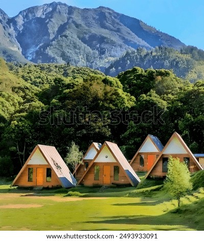 A charming scene featuring a row of triangular wooden cabins set in a lush green landscape, with a majestic mountain range in the background. The cabins, designed in an A-frame style.