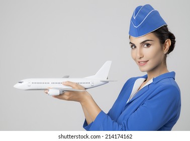 Charming Stewardess Holding Airplane In Hand.