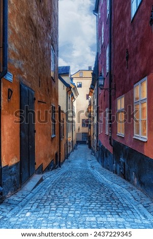 Charming Stockholm street scene with old colorful houses  at sunset in Gamla Stan Old Town district, Sweden