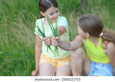 A charming summer scene featuring two girls diligently weeding garden beds in a lush green yard.