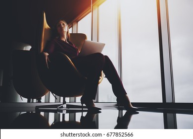 Charming Tired Lady Sprawling Out On Elegant Yellow Armchair In Luxury Office After Difficult Work Meeting, Beautiful Caucasian Businesswoman Chilling After Hard Day And Online Conversation Via Laptop