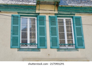 Charming Vintage Windows With Colourful Shutters On The Retro House Outside In Arreau Town, France.