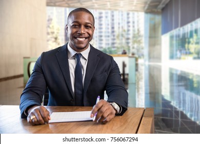 Charming Warm Friendly Smile From Stylish Financial Sales Manager Sitting At Desk With Paperwork