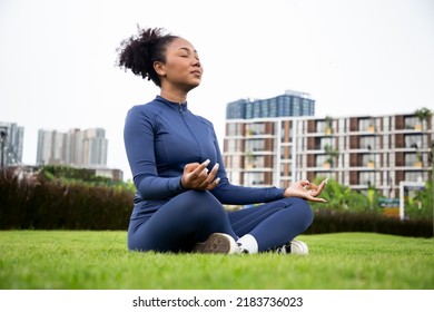 Charming woman doing yoga pose meditation and ballet in garden near condominium or apartment, Healthy body posture with happy feeling in the morning. Sport outdoor or backyard concept. - Powered by Shutterstock