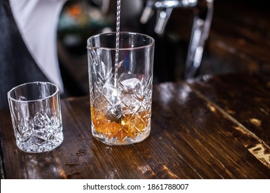 Charming Woman Mixologist Demonstrates His Skills Over The Counter Behind The Bar