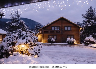 Charming wooden house entrance lit by festive lights, snow-covered stairs, and peaceful winter surroundings. - Powered by Shutterstock