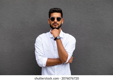 Charming young indian man in casual wear isolated on gray background - Shutterstock ID 2076076720