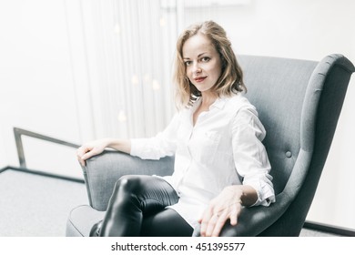 Charming Young Woman In The Chair