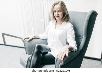 Charming Young Woman In The Chair