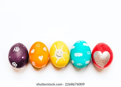 Charmingly colorfully decorated Easter eggs with child's paintings. Funny festive preoccupations