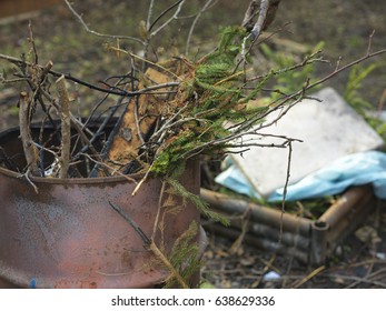 Charred Barrel Of Trash In The Backyard Or Garden, Outdoor Cropped Shot