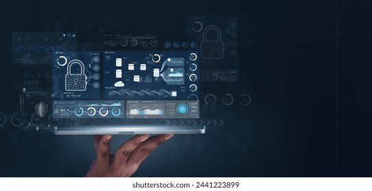 chart, diagram, interface, future, global, graph, management, marketing, strategy, cloud. A person is holding a laptop that has a security screen on it. The screen shows a lock icon and a key. - Powered by Shutterstock - Get 15% off with code: PIKWIZARD15