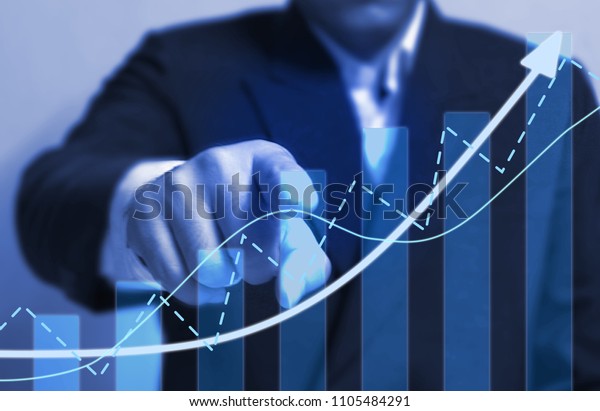 Chart direction up trend and volume with background  business man point finger.