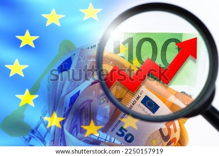Chart over euro banknotes. Inflation chart near EU flag. Rising inflation in European countries. Increasing prices for products concept. Money on grocery cart. Euro inflation red arrow. 
