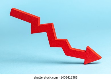 Chart with red down arrow on blue background. Falling growth in business - Powered by Shutterstock