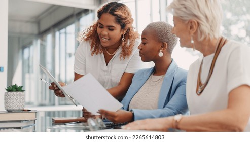 Chart, tablet or business people in a meeting planning kpi, strategy or analytics paperwork for data analysis. Documents, team work or employees in communication or speaking of goals for sales growth - Shutterstock ID 2265614803