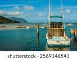 Charter Fishing Boat Moored at Heeia Kea Marina With Mokolii Island  Across Kaneohe Bay, Oahu, Hawaii, USA