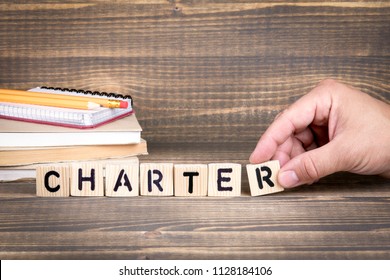 charter. Wooden letters on the office desk, informative and communication background