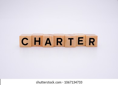 CHARTER word on wooden cubes