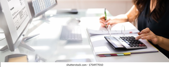 Chartered Accountant Hand Calculating Tax And Salary - Shutterstock ID 1754977010
