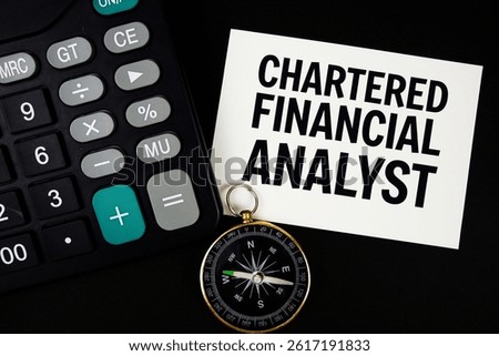 Chartered Financial Analyst text with compass and calculator on black background