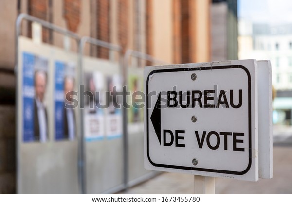 Chartres, France - March 15, 2020: Image of a\
guide to a polling place in France during the French municipal\
elections. French people were urged to vote in local elections amid\
coronavirus lockdown