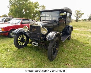 CHASCOMUS, ARGENTINA - Apr 10, 2022: Old Black Ford Model T Fordor Phaeton 1926 In The Countryside  Nature Green Grass And Trees  Classic Car Show  Copyspace