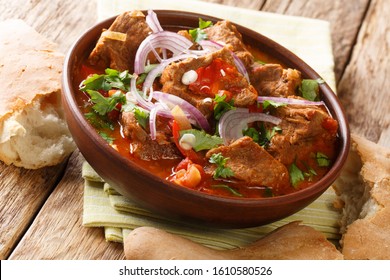 Chashushuli is a traditional Georgian beef stew with tomato sauce close-up in a bowl on the table. horizontal - Shutterstock ID 1610580526