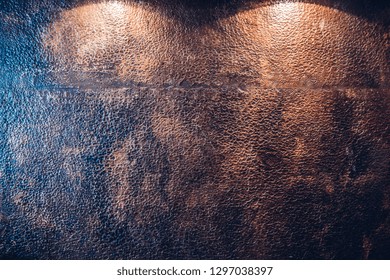 Chasing copper clad kitchen wall work surface with lighting from above.