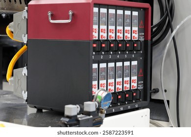 Chassis with digital modular temperature control units for plastic injection molding machine. Multi cavity hot runner temperature controller. Selective focus.