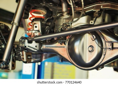 Chassis and Suspension of car.And car shaft cleaning and maintenance at service station,close up. - Shutterstock ID 770124640