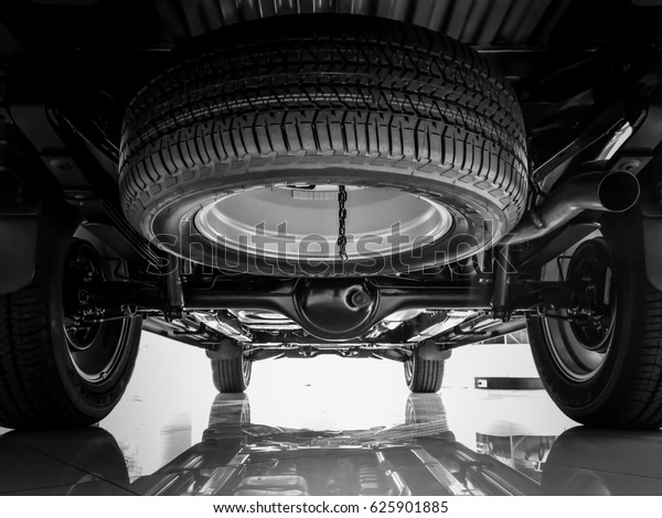Chassis,\
Suspension car , Spare tire black and white\
tone