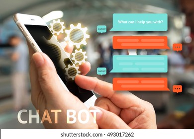 Chat Bot And Future Marketing Concept , Chatbot Icon , Hand Holding Mobile Phone And Gear Popup Out Mobile Screen With Automatic Message Screen With Abstract Background