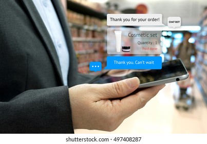 Chat Bot And Future Marketing Concept . Customer Hand Holding Tablet For Order Cosmetic Set And Popup Out Tablet Screen With Automatic Chatbot Message Screen , Supermarket Retail Background