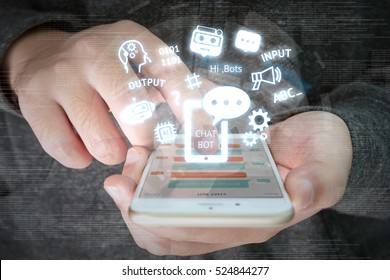 Chat bot and future marketing concept , chatbot connect icons with hand holding mobile phone and icons popup out smartphone screen. - Powered by Shutterstock