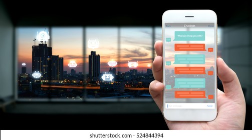 Chat Bot , Robo Everywhere And Future Marketing Concept. Human Hand Holding White Phone , Application Ui And Robot Icons With City Sunset Background