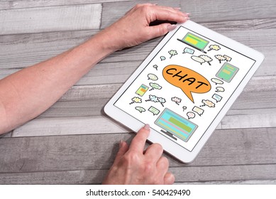 Chat concept shown on a tablet used by a woman