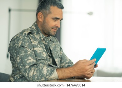 Chat With Family. Serviceman Holding Tablet While Having Video Chat With Family While Missing Them