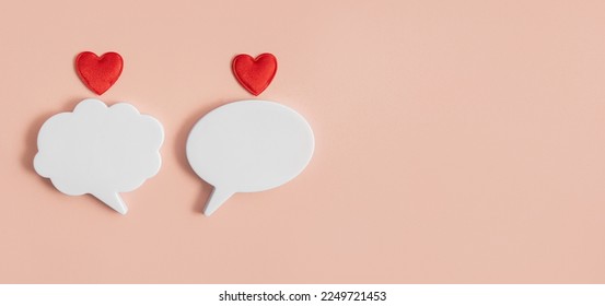 Chat icons with hearts on a light background. The concept of modern love. Valentine's Day. Long distance relationship. Online confession of love. Modern love. Copy space.