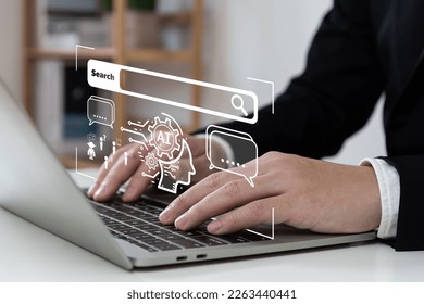 Chatbot with AI (Artificial Intelligence), search engine, businessman using laptop connection to AI, use command prompt for generates idea something or solve problems, digital transformation, SEO. - Shutterstock ID 2263440441