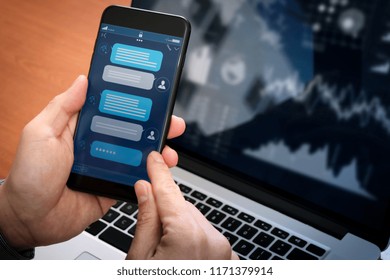 Chatbot conversation with smartphone screen app interface and artificial intelligence technology processing virtual assistant with customer support information, business hand holding mobile phone.