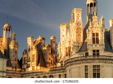 Chateau De Chambord At Sunset, France. This Castle Is A Landmark Of The Loire Valley. Amazing View Of Rooftop Of The Renaissance Castle. Panorama Of The Beautiful Decorations Of The French Castle.