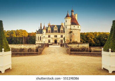 Chateau de Chenonceau in Loire Valley, France. Scenic view of old castle, chateau Chenonceau in sunset light. Vintage style photo of Chenonceau palace located near village of Chenonceaux in summer.