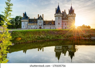 Chateau De Sully-sur-Loire At Sunset, France. Scenery Of Old Castle, Landmark Of Loire Valley. Scenic View Of Medieval Castle And Sun. Panorama Of French Chateaux By Loire River, Landscape In Sunlight