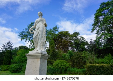 Chateau In Fontainbleau, France And A Statue 