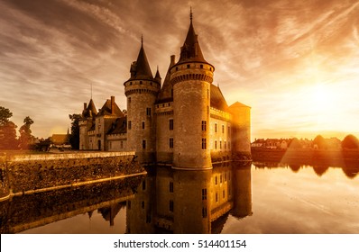 Chateau of Sully-sur-Loire at sunset, Loire Valley, France. This castle is an example of medieval fortress. Sunny panorama of the old French Renaissance castle on the water in evening. UNESCO site.  - Powered by Shutterstock