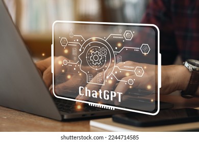 ChatGPT Chat with AI or Artificial Intelligence. Young businessman chatting with a smart AI or artificial intelligence using an artificial intelligence chatbot developed by OpenAI.