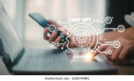 ChatGPT Chat with AI or Artificial Intelligence. woman chatting with a smart AI or artificial intelligence using an artificial intelligence chatbot developed by OpenAI. - Shutterstock ID 2246749881